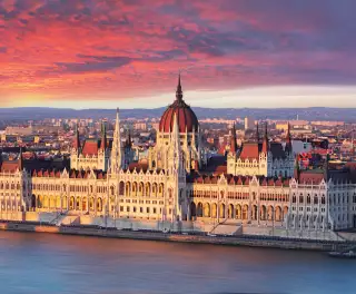 Aerial view of parliament building at dramatic sunrise in Budapest, Hungary